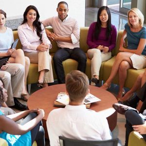 RevCats professionals sitting around a coffee table